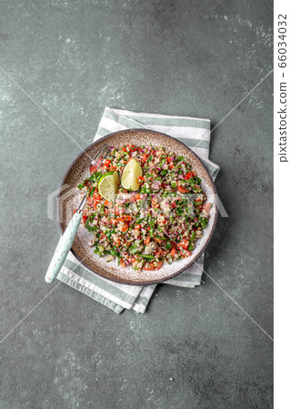 Traditional Lebanese salad tabouli tabule with quinoa, herbs, tomatoes, mint and lemon Traditional Lebanese salad tabouli tabule with quinoa, herbs, tomatoes, mint and lemon 66034032