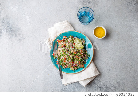 Quinoa Quinua salad with tomatoes and herbs in white bowl Quinoa Quinua salad with tomatoes and herbs in white bowl 66034053