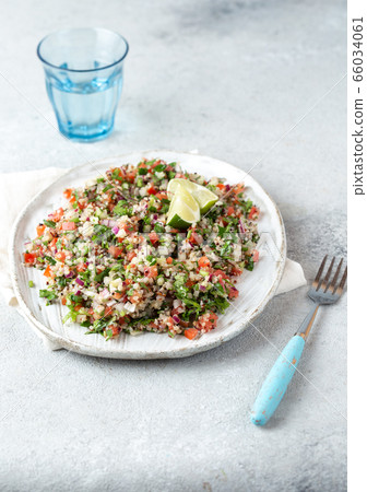 Quinoa Quinua salad with tomatoes and herbs in white bowl Quinoa Quinua salad with tomatoes and herbs in white bowl 66034061