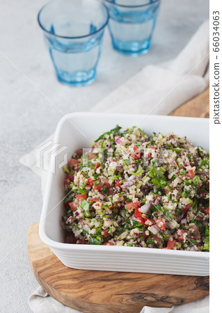 Quinoa Quinua salad with tomatoes and herbs in white bowl Quinoa Quinua salad with tomatoes and herbs in white bowl 66034063