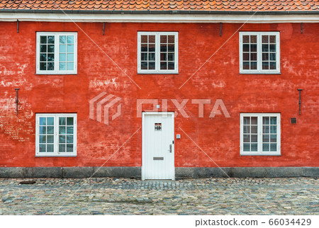 Old red house with white windows and door, Kastellet, Copenhagen, Denmark 66034429