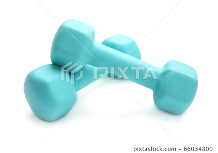 Two turquoise colored rubber dumbbells lying at white table Two turquoise colored rubber dumbbells lying at white table 66034800