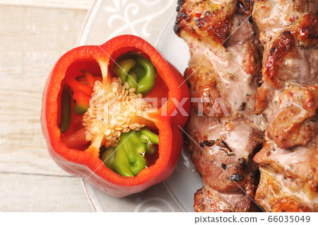 red pepper and pork skewers on skewers in a plate 66035049