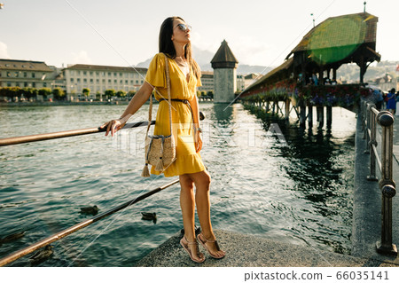 fashion woman in summer dress travelling Europe on fashion woman in summer dress travelling Europe on 66035141