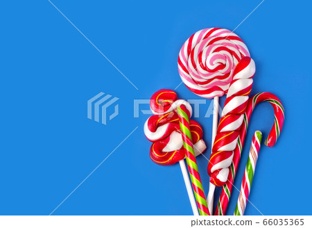 Colorful lollipop on blue 66035365