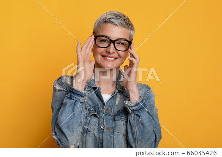 Eyesight and Vision Concept. Positive Beautiful Mature Woman Wearing New Stylish Eyeglasses 66035426