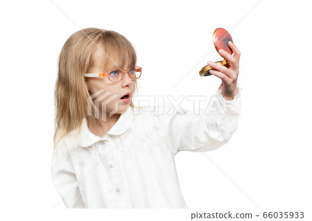 child admires himself in the mirror 66035933