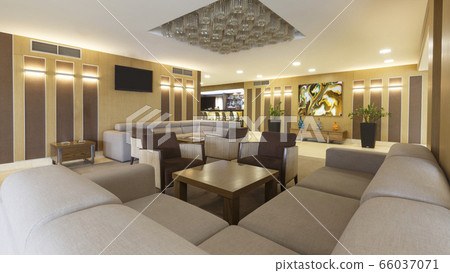 Large sofa, table and plants in hotel lounge Large sofa, table and plants in hotel lounge 66037071