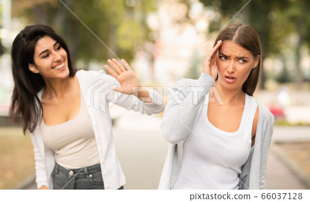 Girl Avoiding Meeting Toxic Friend Ignoring Her Greeting Walking Outdoors 66037128