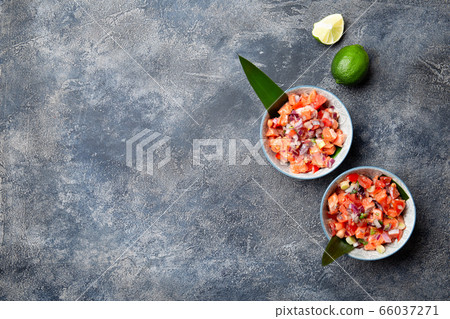 Hawaiian food Salmon Lomi Lomi. Salmon with tomatoes, onion and lemon Hawaiian food Salmon Lomi Lomi. Salmon with tomatoes, onion and lemon 66037271