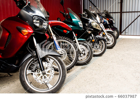 Colored sports road beautiful bikes in motor show Colored sports road beautiful bikes in motor show 66037987