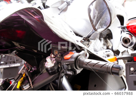 Right side of motorcycle steering wheel close-up Right side of motorcycle steering wheel close-up 66037988