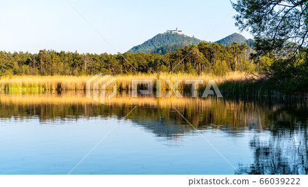 Medieval Castle Bezdez on the top of Bezdez Mountain. Reflected in Brehynsky Pond, Czech Republic 66039222
