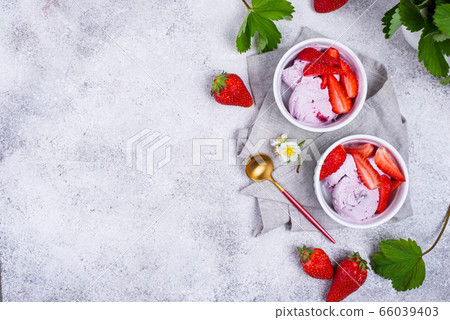 Strawberry ice cream in white bowl Strawberry ice cream in white bowl 66039403