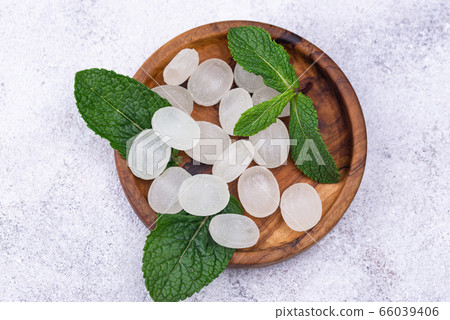 Sweet hard peppermint candy and mint Sweet hard peppermint candy and mint 66039406