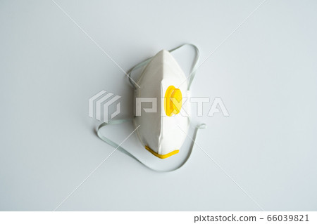 Respirator mask FFP or dust mask to cover the mouth and nose prevent coronavirus isolated on gray background. Breathing protection against air pollution, flu and coronavirus. 66039821