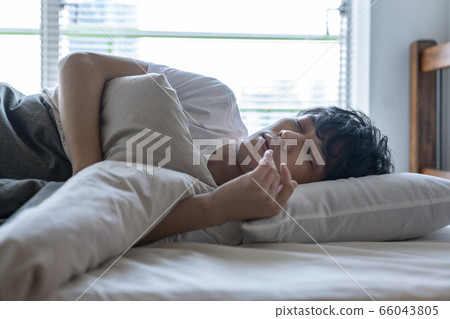 Young man sleeping face 66043805