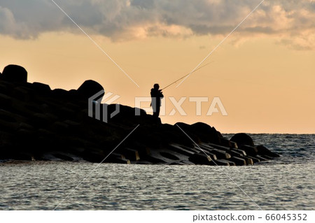 Dusk surf fishing (silhouette) Dusk surf fishing (silhouette) 66045352