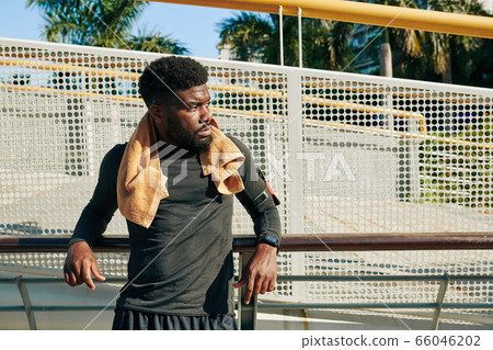 Serious tired young athlete 66046202