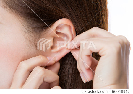 Ear close-up young woman. Ear close-up young woman. 66048942