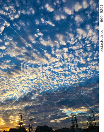 A sunset glow of a sheep cloud A sunset glow of a sheep cloud 66049291