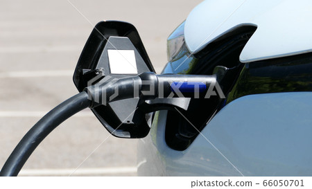 Detail of the front side of electric car charging 66050701