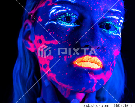 Picture of young girl with bright make-up in neon 66052666