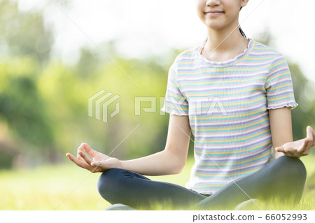 Meditation,Happy smiling woman meditating on the green grass at park,asian child girl practicing yoga meditation in nature outdoor,relax,enjoy breathing fresh air after Covid-19 quarantine,Coronavirus Meditation,Happy smiling woman meditating on the green grass at park,asian child girl practicing yoga meditation in nature outdoor,relax,enjoy breathing fresh air after Covid-19 quarantine,Coronavirus 66052993