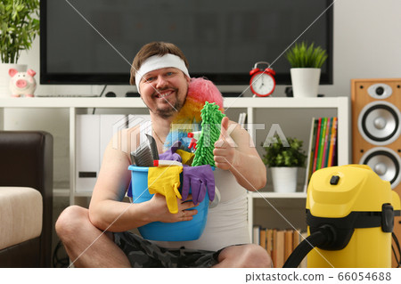 Positive delighted overweight man being at home Positive delighted overweight man being at home 66054688