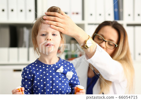 Upset little girl looking straight at camera Upset little girl looking straight at camera 66054715