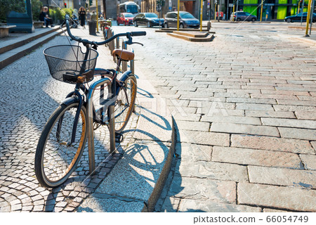 Bicycle parked on city street Bicycle parked on city street 66054749