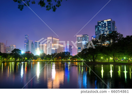 Night view of skyscrapers in Bangkok and lake in 66054861