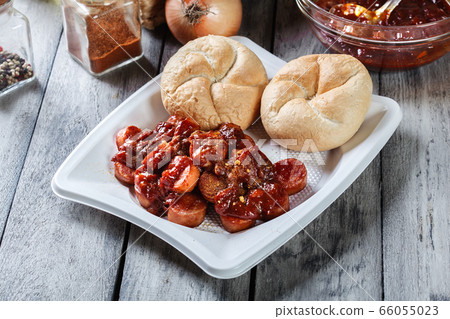 Delicious German currywurst - pieces of sausage Delicious German currywurst - pieces of sausage 66055023