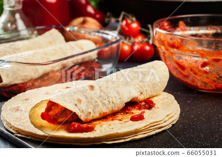 Preparation traditional mexican enchiladas with 66055031