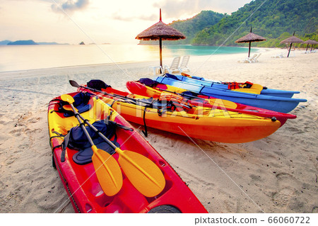 stack of sea kayak on beautiful sand beach against stack of sea kayak on beautiful sand beach against 66060722