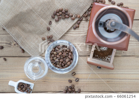 Ground beans in a coffee mill Ground beans in a coffee mill 66061254