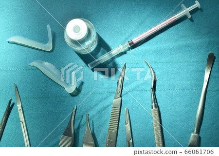 Surgical instruments, silicone nasal implant and silicone chin implants in operating room. 66061706