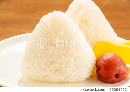 Rice ball (salt rice ball). Served with pickles (dried plums and takuan). 66061912