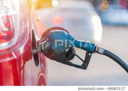 Car refueling on the petrol station with pumping gasoline fuel in car, diesel or gasoline Car refueling on the petrol station with pumping gasoline fuel in car, diesel or gasoline 66065117