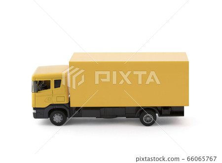 Yellow cargo delivery truck miniature isolated on white background with clipping path Yellow cargo delivery truck miniature isolated on white background with clipping path 66065767