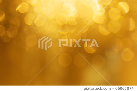 Golden holiday light background, beautiful shiny sparkles. Beautiful light from garland on the 66065874