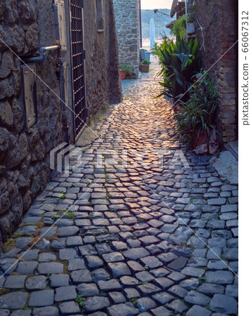 Old town street on evening in Italy Old town street on evening in Italy 66067312