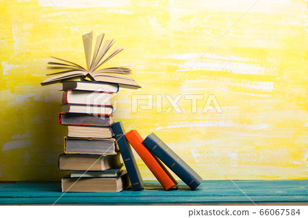 Books on wooden desk table and abstract background. Education background. Copy Space. Back to school. 66067584