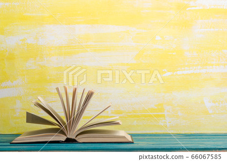 Books on wooden desk table and abstract background. Education background. Copy Space. Back to school. 66067585