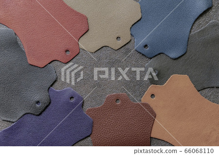 Multicolored leather samples on dark leather, abstract background, choice of colors, shades color. Top view 66068110