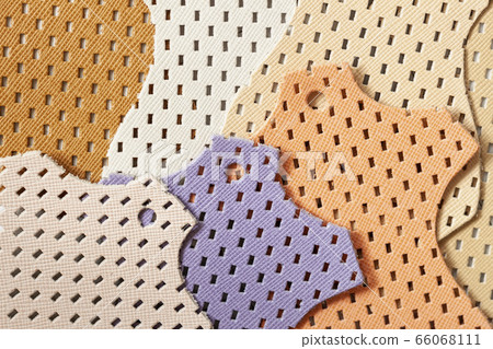 Bright samples of colorful perforated genuine leather, texture, for background 66068111