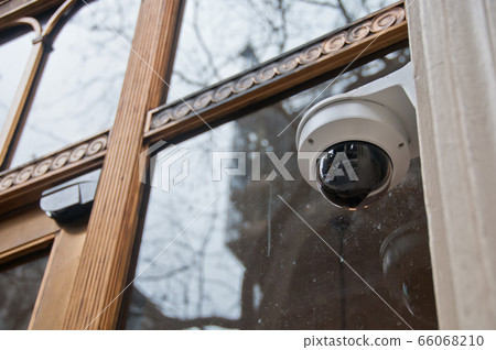 Surveillance CCTV security dome camera near office Surveillance CCTV security dome camera near office 66068210
