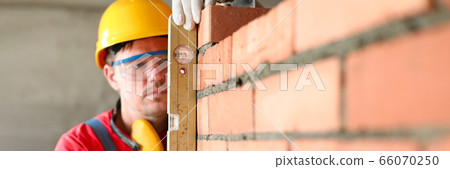 Man working at building Man working at building 66070250