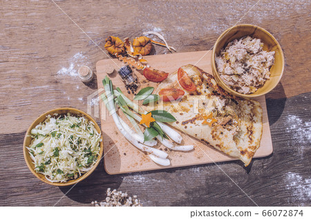 Rolls pancakes stuffed with meat. 66072874