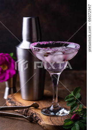 Pink cocktail Margarita with rose syrup 66072947
